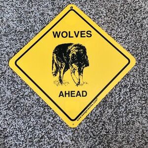 WOLVES AHEAD CAUTION plastic sign